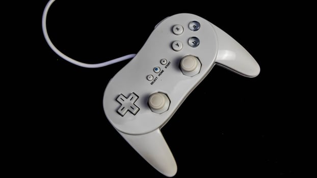 white joystick isolated black background photo