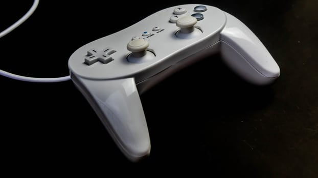 white joystick isolated black background photo