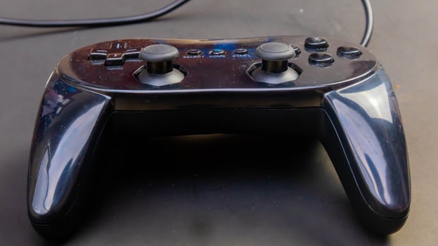 black joystick isolated black background photo