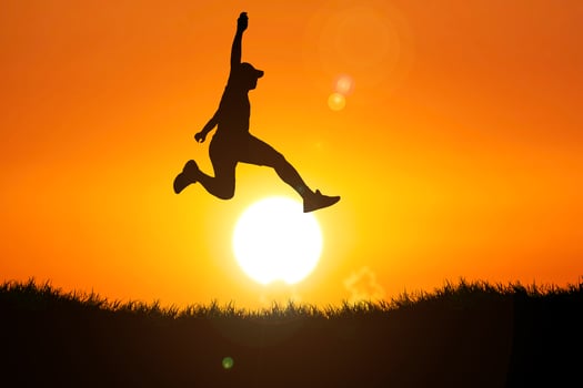 Silhouette of a man jumping. The concept of skipping, passing, moving forward. photo