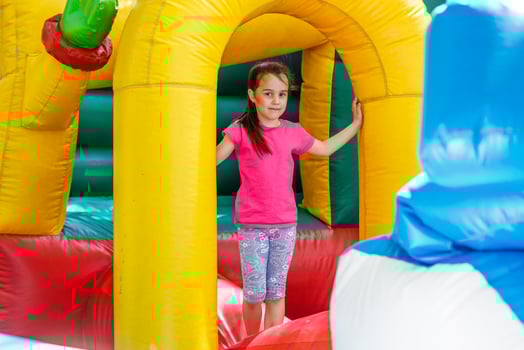 child on a colorful trampoline photo