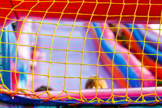 mesh on an inflatable trampoline. Active games for children photo