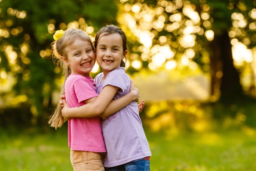 Beautiful little girls enjoying outside photo