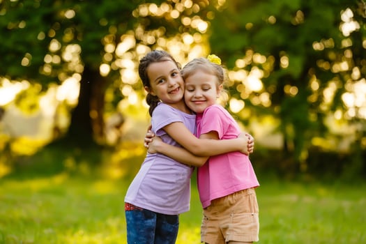 two little girls walking in the field. photo