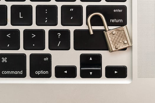 Cyber safety concept, locked and key on laptop computer keyboard ,key to unlock before green background.Key and Lock photo