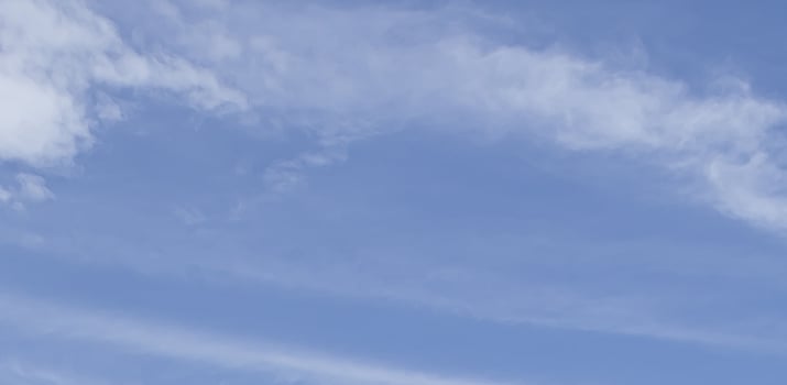 Image of a partly cloudy and partly clear sky during the day photo