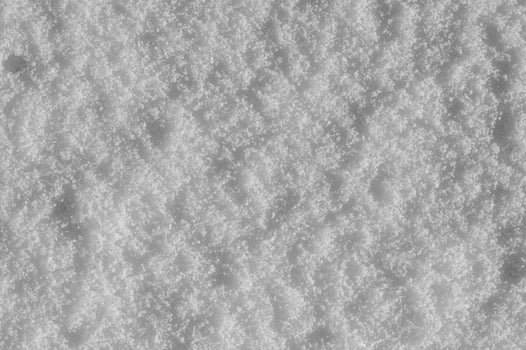 Winter snow background, ice crystals sparkling on snow, christmas texture, sparkling snowflakes in snowdrift. photo