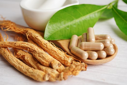 Ginseng roots and green leaf, healthy food. photo
