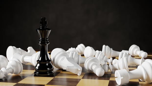 Black chess king among lying white pawns on a chessboard. 3D rendering illustration. photo