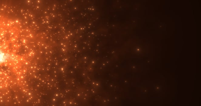 Abstract orange fiery flame bonfire of particles and sparks glowing beautiful magical on a dark background. Abstract background photo