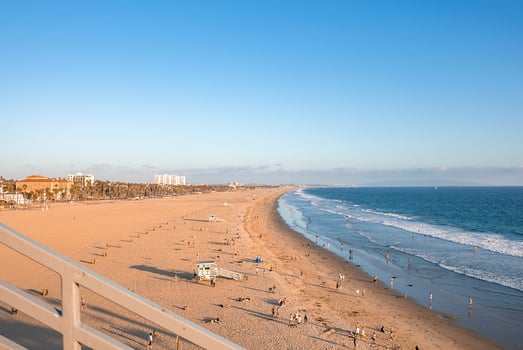 Beautiful view of seascape and sandy beach with blue sky in background photo