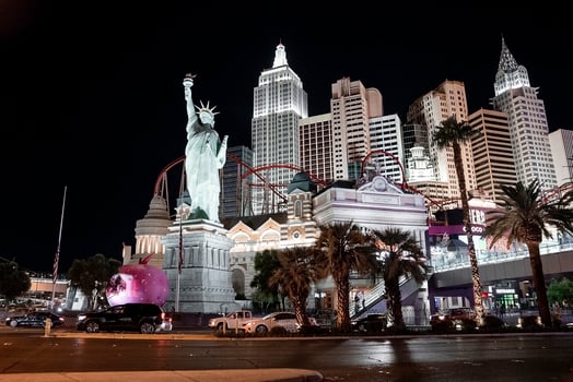 View of cars on road by Replica of Statue Of Liberty in New York, New York hotel photo