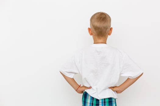 Back white T-shirt on a boy, isolated on white background photo