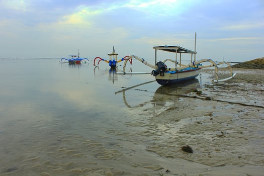 View of a fishing boat on the beach. photo
