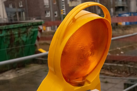 orange warning light at a construction site photo
