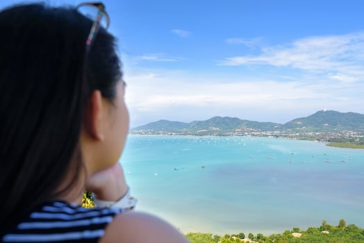 Woman tourist watching the ocean in Phuket, Thailand photo