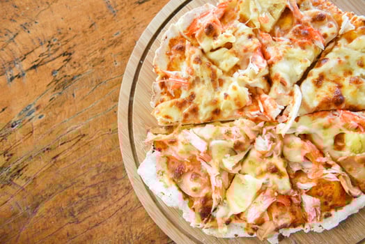 Pizza cheese slice on wooden tray and served on a wooden table , top view Homemade pastry pizza Italian is cooked traditional food photo
