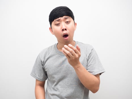 Man gesture yawn feel sleepless with dark circle under his eyes photo