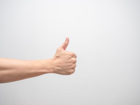 Man hand make thumb up white isolated photo
