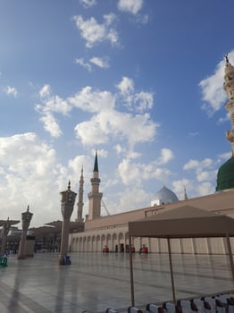 Beautiful daytime view of Masjid Al Nabawi, Medina's green dome, minarets and mosque courtyard. photo