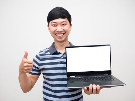 Portrait cheerful man striped shirt thumb up holding laptop white screen happy smile photo