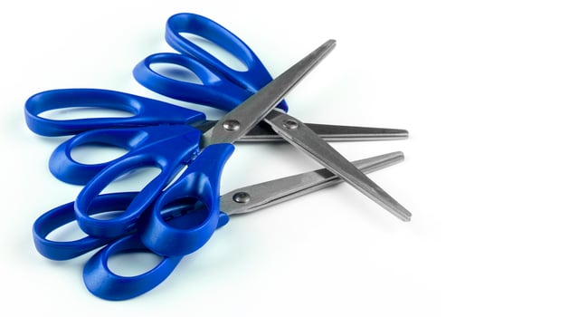 set of new blue paper scissors isolated on a white background photo