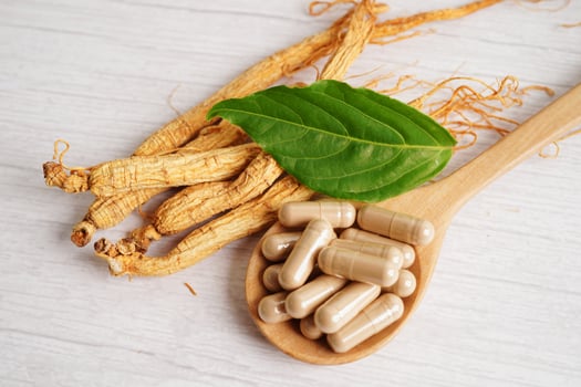 Ginseng roots and green leaf, healthy food. photo