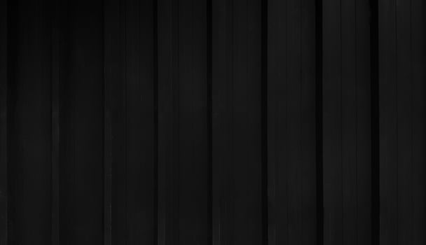 Black stainless steel background in vintage tone. Dark shutter door wall with copy space. Line pattern of curtain or zinc wallpaper concept. photo