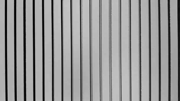 Gray pastel line pattern of concrete wall for background. Grey painted cement column of wallpaper and Exterior design or build structure. photo