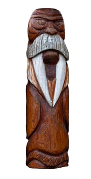 wooden idol statue of koryak on a white background photo