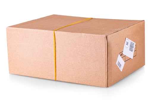 Closed cardboard box taped up and isolated on a white background. photo
