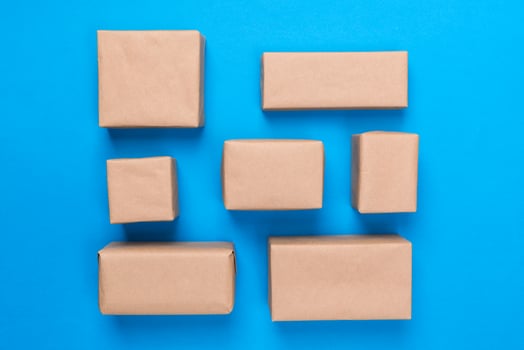 a lot of cardboard box on blue wooden background. top view photo
