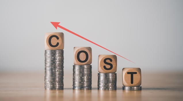 Wooden blocks on pile of coins,Consistently Higher Inflation Concept,financial crisis affecting people all over the world,Currency problems that affect costs and prices of products photo