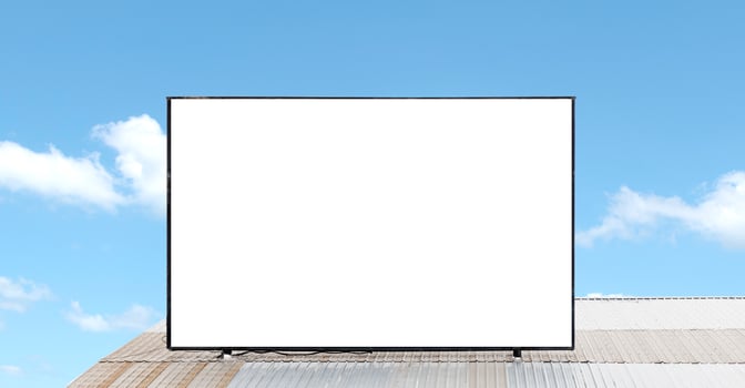 Outdoor billboard on roof and blue sky background with white background mock up. clipping path photo
