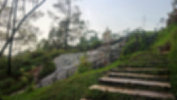 stairs, green grass and sulfur rocks in a tourist place photo