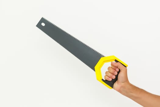 hand holding a saw isolated on white background photo