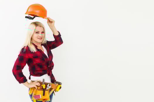Sexy young woman construction worker photo