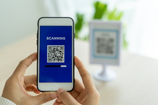 Woman use smartphone to scan QR code to pay in cafe restaurant with a digital payment without cash. Choose menu and order accumulate discount. E wallet, technology, pay online, credit card, bank app. photo