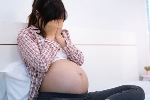 Pregnant women suffer from depression. The woman was disappointed and sad. photo
