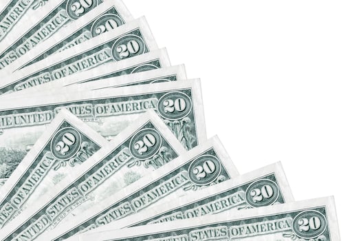 20 US dollars bills lies isolated on white background with copy space stacked in fan close up photo
