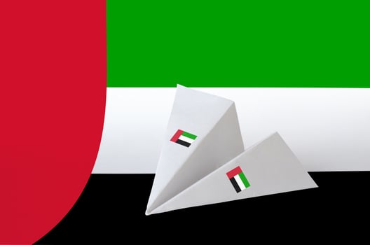 United Arab Emirates flag depicted on paper origami airplane. Handmade arts concept photo