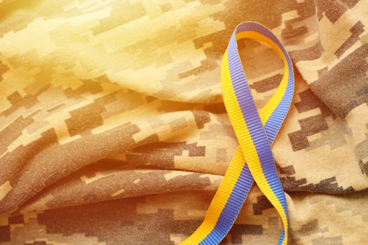 Pixeled digital military camouflage fabric with ribbon photo