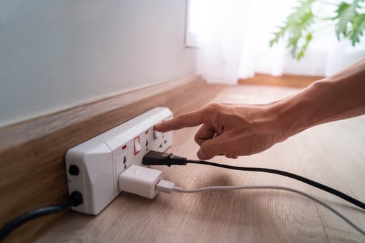 Save electricity, energy saving and environmental protection. Man's finger press on the button to turn off the light. Economical use of electricity photo