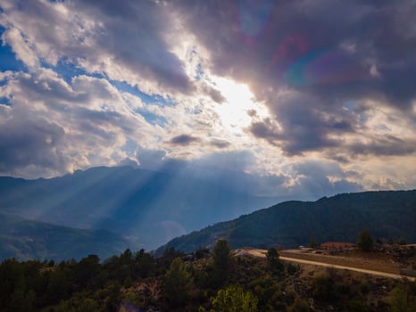 perfect filtering of the sun's rays through the clouds photo