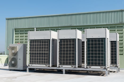 Compressors, air conditioners on the roof of the office building photo