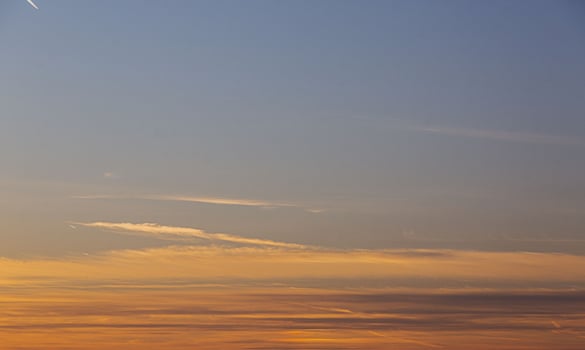 Dramatic colorful sky with afterglow and illuminated clouds photo