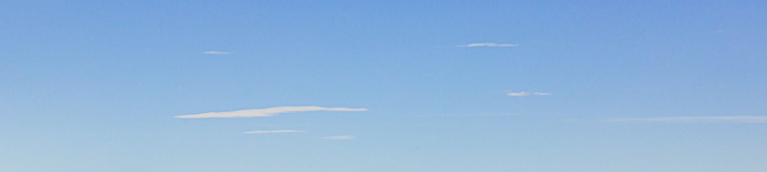 Image of a partly cloudy and partly clear sky during the day photo