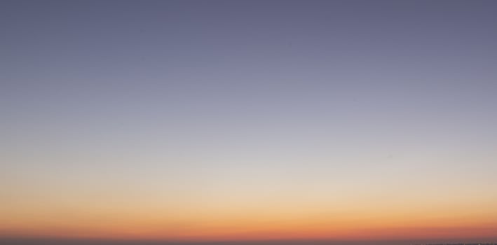 Dramatic colorful sky with afterglow and illuminated clouds photo