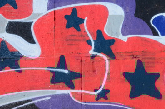 Fragment of graffiti drawings. The old wall decorated with paint stains in the style of street art culture. Colored background texture in cold tones photo