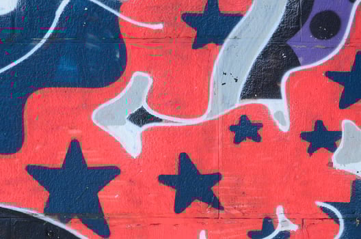 Fragment of graffiti drawings. The old wall decorated with paint stains in the style of street art culture. Colored background texture in cold tones photo